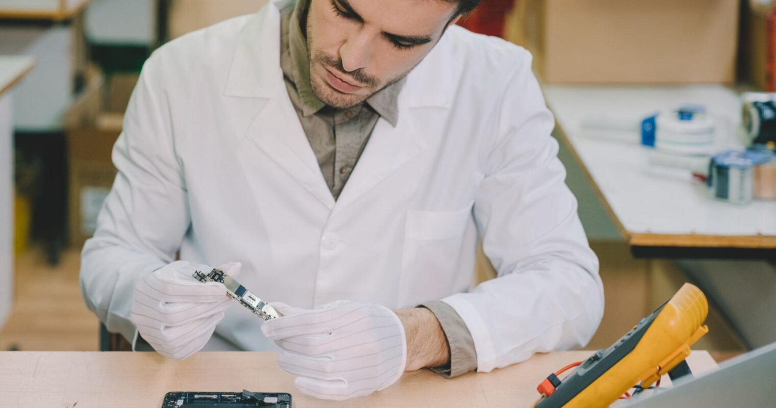 Person refurbishing a mobile device